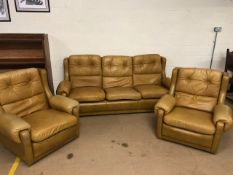 Late 20th century three seater sofa and 2 matching arm chairs upholstered in golden tan leather,