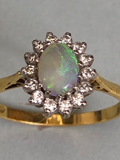 18ct Gold ring set with an oval Opal and surrounded by diamonds 'P' - Image 3 of 5