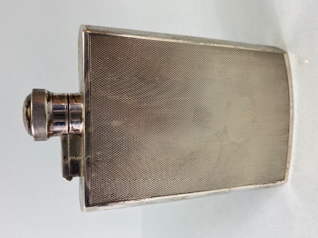 Silver hallmarked Hip flask with engine turned decoration and twist down lid hallmarked for