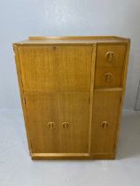 White & Newton Mid Century light teak cupboard with offset drawers and fall front cupboard, approx