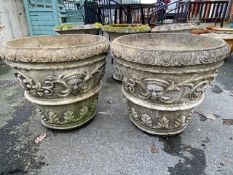 Two large concrete garden planters, approx 50cm tall