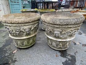 Two large concrete garden planters, approx 50cm tall