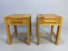 Pair of modern light wood bedside tables each with single drawer and glass shelf below