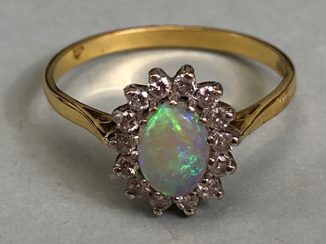 18ct Gold ring set with an oval Opal and surrounded by diamonds 'P' - Image 5 of 5