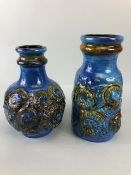 Mid Century pottery, an associated pair of West German vases by, Carstems, decorated in high