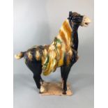 Oriental Ceramics, Chinese Tang Horse of usual form decorated in dark blue glaze with green and