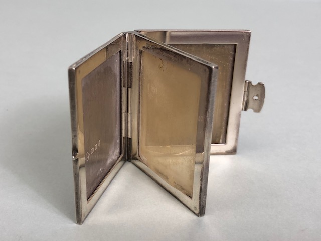 Silver Hallmarked miniature photo frame in the form of a book with clasp opening to reveal four - Image 3 of 4