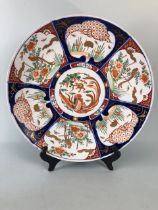 Oriental ceramics, a larger Imari charger decorated with panels of birds and a phoenix to the
