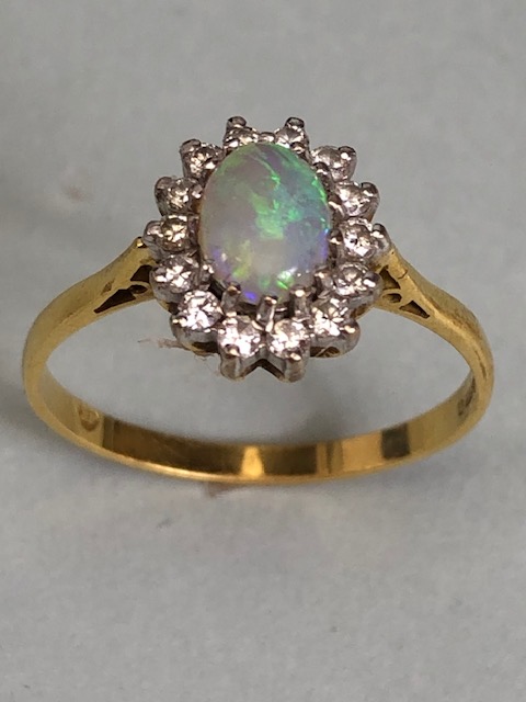 18ct Gold ring set with an oval Opal and surrounded by diamonds 'P' - Image 2 of 5