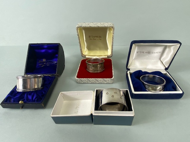 Collection of four boxed Silver hallmarked various styles of napkin rings (total weight 109g)