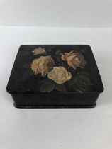 Victorian paper mâché jewellery box, the lid decorated with roses, red interior, approximately 18