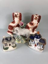 Staffordshire pottery , two flat back mantel houses a Ram spill holder, and a pair of King Charles