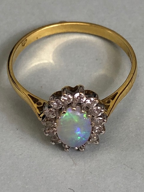 18ct Gold ring set with an oval Opal and surrounded by diamonds 'P' - Image 4 of 5