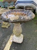 Large concrete garden shell birdbath on plinth, approx 68cm tall