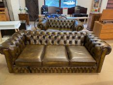 Three seater and a two seater Chesterfield style sofas, the larger a bed settee