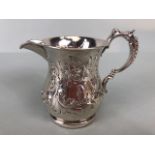 Victorian Silver Hallmarked Cream Jug Birmingham 1877, decorated with repousse flora and foliage and