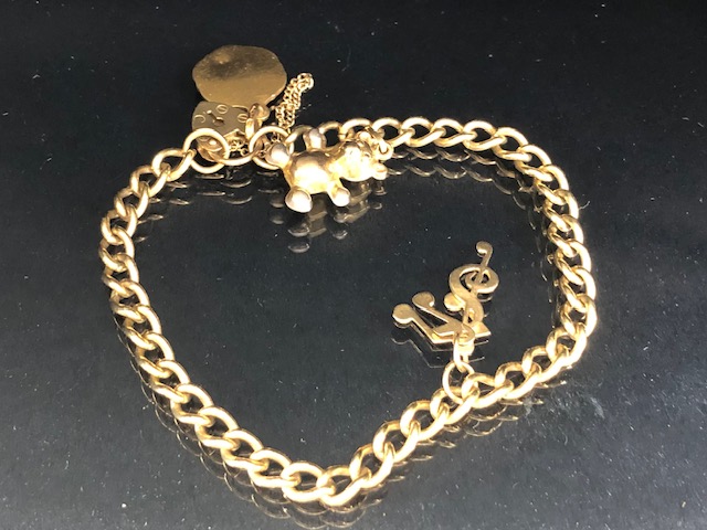 9ct Gold bracelet with 9ct Gold heart shaped lock and 9ct St Christopher and musical notes total - Image 2 of 6