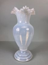 Art Glass: A Vaseline Translucent Blue glass vase on a stepped circular base with a wavey rim approx