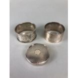 Silver hallmarked lined compact and two hallmarked silver napkin rings (total weight approx60g)