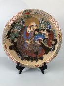 Oriental ceramics, Robust Japanese pottery dish or charger decorated in heavy glaze with Daruma