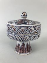 Japanese pottery, Archaic form Imari style tall footed dish and cover, with typical early red and