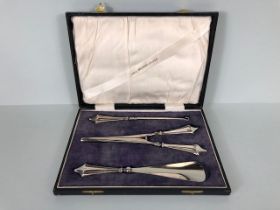 Silver handled set of Button pull, glove stretcher and shoe horn in presentation case