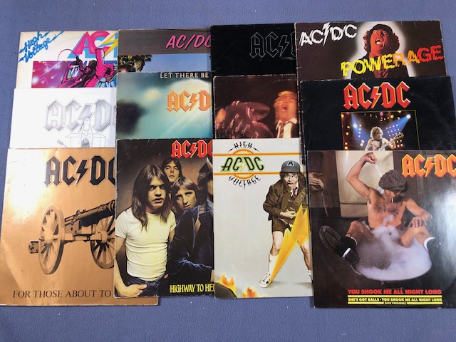 12 ACDC LPs/12" including: High Voltage (with cartoon sleeve), Flick Of The Switch, Dirty Deeds, Let