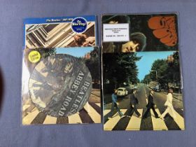 4 The Beatles LPs including: Abbey Road (picture disc), 1967-70 (blue vinyl), Abbey Road (misaligned
