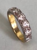 18ct Yellow and White Gold seven stone Diamond ring size approx J.5 and total weight 5.8g