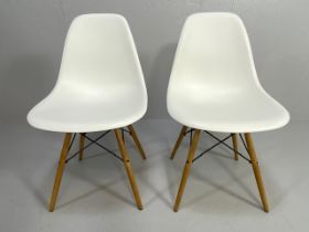 Vitra Eames, design Charles and Ray Eames, pair of white plastic moulded chairs