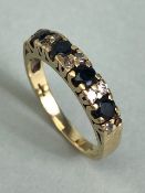 9ct Gold ring set with alternate pairs of diamonds and faceted Sapphires (A/F)