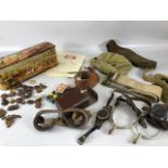 Military interest, a tin containing a collection of military related items wartime and post war to