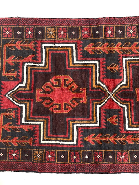 Oriental hand knotted wool carpet Baluchi geometric patterns on a dark burgundy background - Image 3 of 5