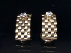 Pair of 9ct Gold clip on earrings with gold link design and each mounted with a good diamond in a