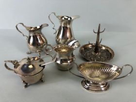 Silver hallmarked Items to include a ring stand, three hallmarked silver jugs or creamers, a