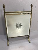 Brass and glass fire screen with central starburst design and bevel edge