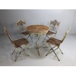 French style bistro table and four folding chairs, with latticework design and moulded finials,