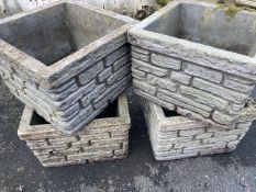 Four matching garden planters with brickwork design