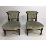 Pair of low button back, upholstered, wooden framed nursing chairs