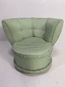 Mid century padded Tub Chair for a bedroom upholstered in pale green fabric