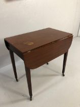 Mahogany Pembroke table on tapering legs with brass castors approx 38 x 66 x 64cm