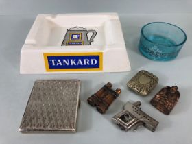 Vintage smoking memorabilia to include, advertising ashtrays, vesta case, novelty lighters,