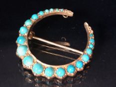 Antique Jewellery: a 9ct hallmarked Brooch of Horse shoe design set with Graduated Turquoise