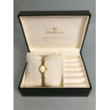 9ct Gold wristwatch and 9ct Gold strap by maker Sovereign with Gold faves and baton markers in