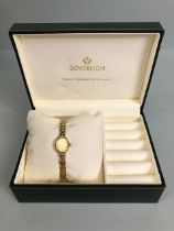 9ct Gold wristwatch and 9ct Gold strap by maker Sovereign with Gold faves and baton markers in