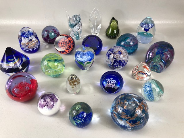 Paperweights, a collection of vintage glass paper weights of varying patterns and shapes the