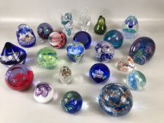 Paperweights, a collection of vintage glass paper weights of varying patterns and shapes the