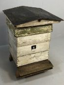 Beehive, vintage full size wooden bee hive consisting of stand individual layers and roof,