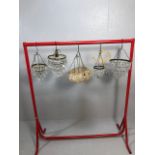 Vintage lighting, four small decorative chandeliers of varying sizes and styles along with a mid