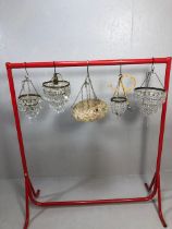 Vintage lighting, four small decorative chandeliers of varying sizes and styles along with a mid